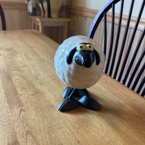 Ceramic bouncing sheep figure